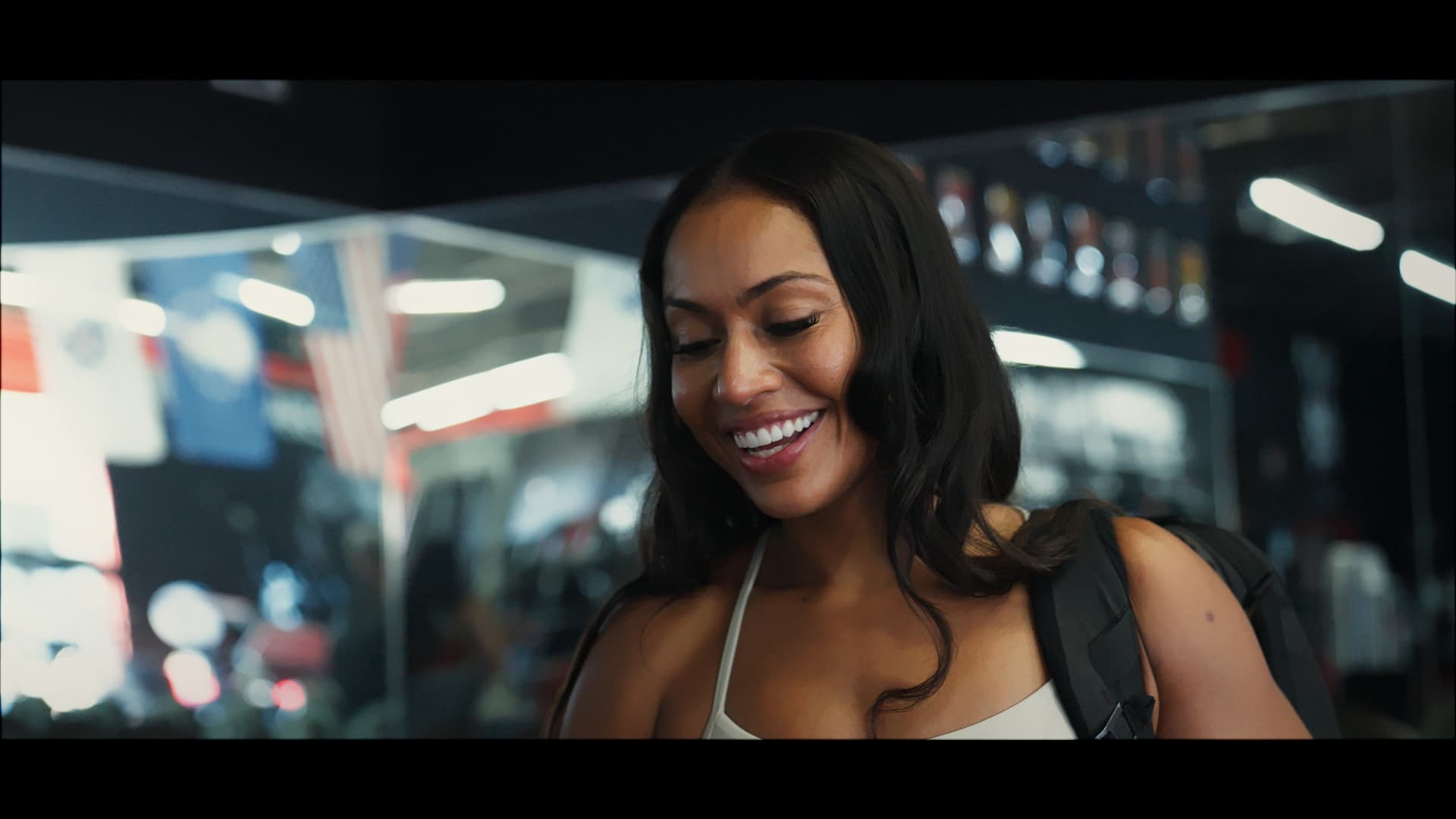 Shamaira walking into the gym with her training bag